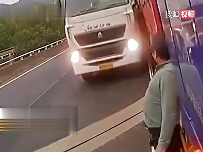 Truck driver hit by second truck on busy road.