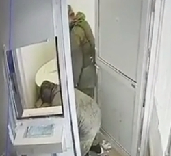 Russian army stealing a safe from Ukrainian bank.