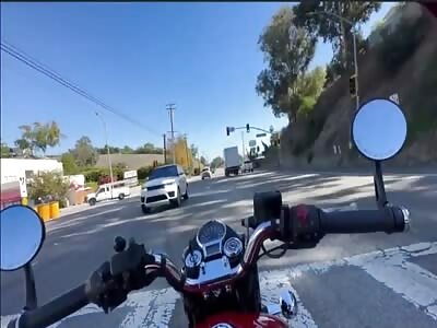 Pick-up truck is pushed into crushing biker