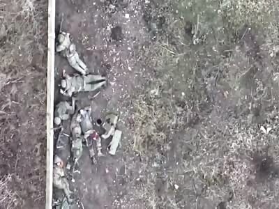 A group of hiding and wounded RU soldiers is targeted by a UA drone