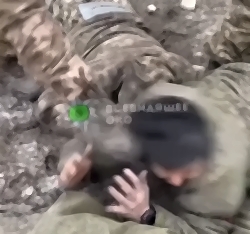 UA soldiers beating captured Kazakh soldier