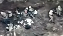 Russian troops in a trench, some are dead