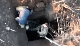 UA  drone drops a grenade on a RU  soldier in a foxhole