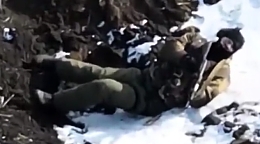 A wounded and armed RU soldier is targeted by a UA drone