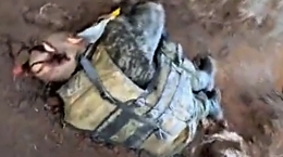 UA soldier shows dead RU soldier (shot to his head)