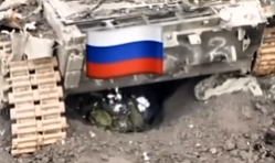 UA soldier throws a grenade under a tank where RU soldier is hiding