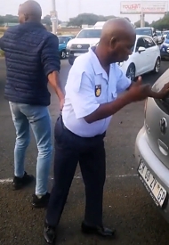 A drunk South African police officer knocked a woman off her bike