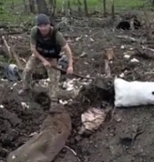 Ukrainians burying KIA Russian soldiers