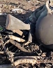 UAF soldier shows the dead remains of RF troops in the East