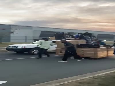 South African looters, stealing by the pallet.