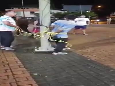 Thief cruelly whipped by angry fat citizens 