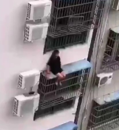 Girl Falls from Apartment while Trying to Climb