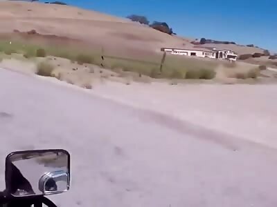 Biker collides violently on country road.