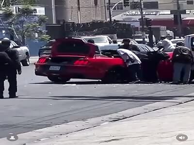 Driver wrecks car in LA. Immediately surrounded by people who loot