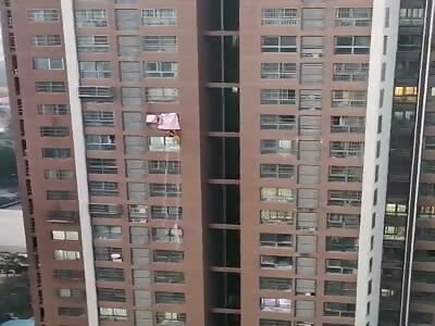 Woman falls from building.