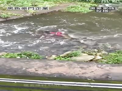 Injured biker swept by river.