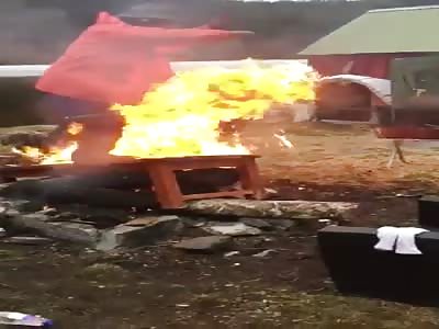 Guy Lights Himself On Fire Trying To Put Out Jerry Can Fire.