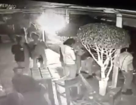 Terrible surprise for people standing in front a bar 