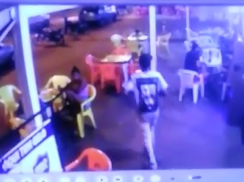 CCTV Captures Walk By Precision Like Execution of Man Sitting Down Enjoying His Dinner 