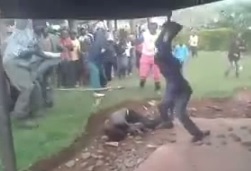 Man is BRUTALLY Beaten with Sticks, Stones ..... and a HOE!