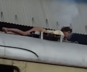 Woman Roasts on Top of a Train
