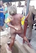 Fat Woman Kidnapper Stripped and Beaten by Crowd
