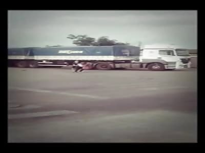 Woman throws herself under the wheels of a truck