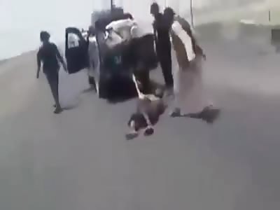 TORTURED, BEATEN, DRAGGED BY THE ROAD