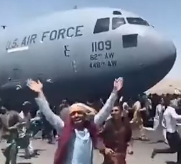 AFGHANS FALL FROM US PLANE 