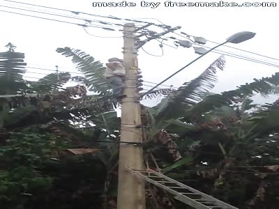 Man on Electric Pole Working Until Electric Shock Makes Him Fall