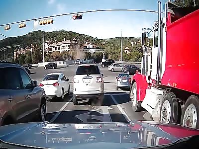 Dump Truck Smashes Through an Intersection and Catches Fire