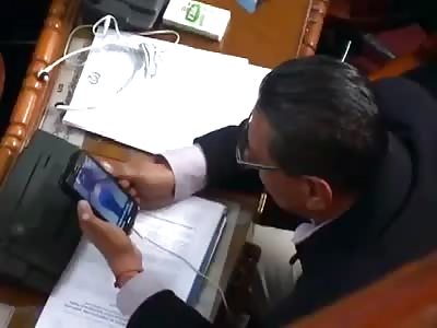 Bolivia's Deputy Caught Watching Videos of (Ass Festival) on His Cell Phone in Full Session of Parliament 