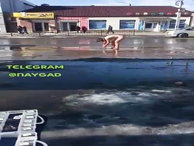 drugged nude woman bathing in the street