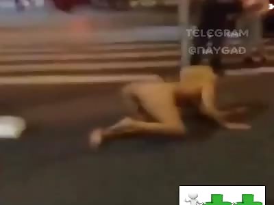 Nude drugged woman fingering in the middle of the street 