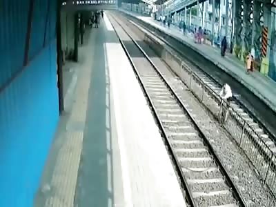Stupid Indian man nearly trapped under train 