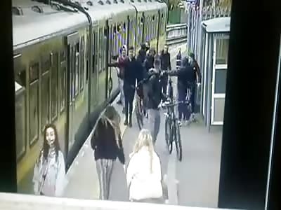 Innocent girl pushed under train onto the track by group of hooligans.
