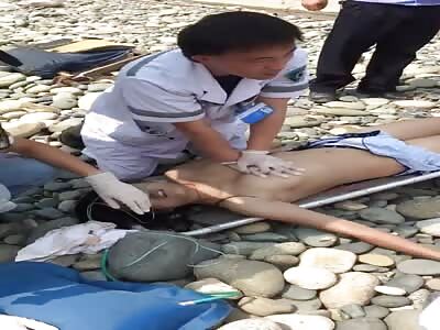 Desperate effort to restart heart of drowned Chinese woman.