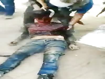Cartel Members Beat And Humilate Rival's Corpse