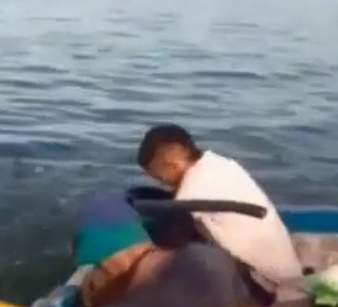 Two Men In A Boat Gets Executed With A Machine Gun