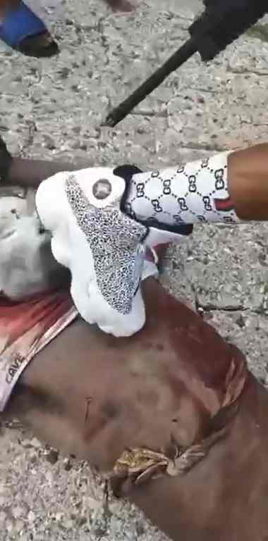 Gang Member Shows Off His Latest Kill And His Gucci Socks