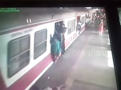 Two women escape unhurt as they were dragged by the local train in Ind