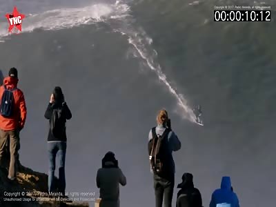 British surf champion breaks his back in wipeout by 50 ft wave in Portugal