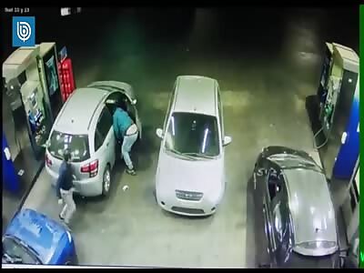 A thief gets a nice surprise from a police officer at a petrol station in Chile