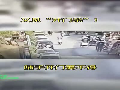 Opening car door on a busy road accident in Xiaxindian Town