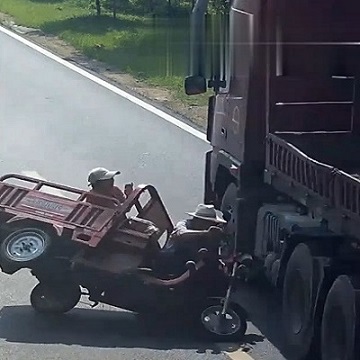 A Motor-Driven Tricycle Tip Toes Into a Trailer