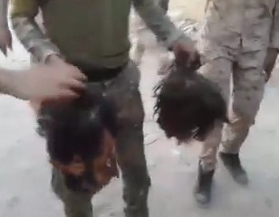 Iraqi Soldiers Dance with Severed Heads of ISIS 