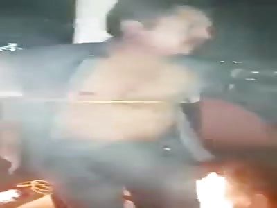 Man caught stealing , tied to Pole and tortured with Fire