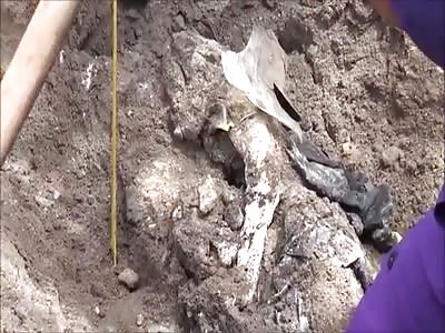 Decomposed murder victim found buried under house foundations