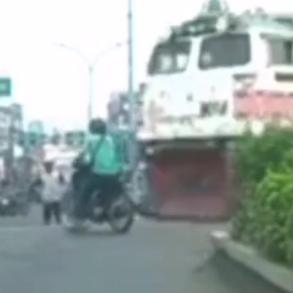 HOLY SHIT: Indonesian Biker Destroyed By Train