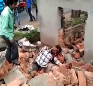Worker in Agony after being crushed by a concrete wall